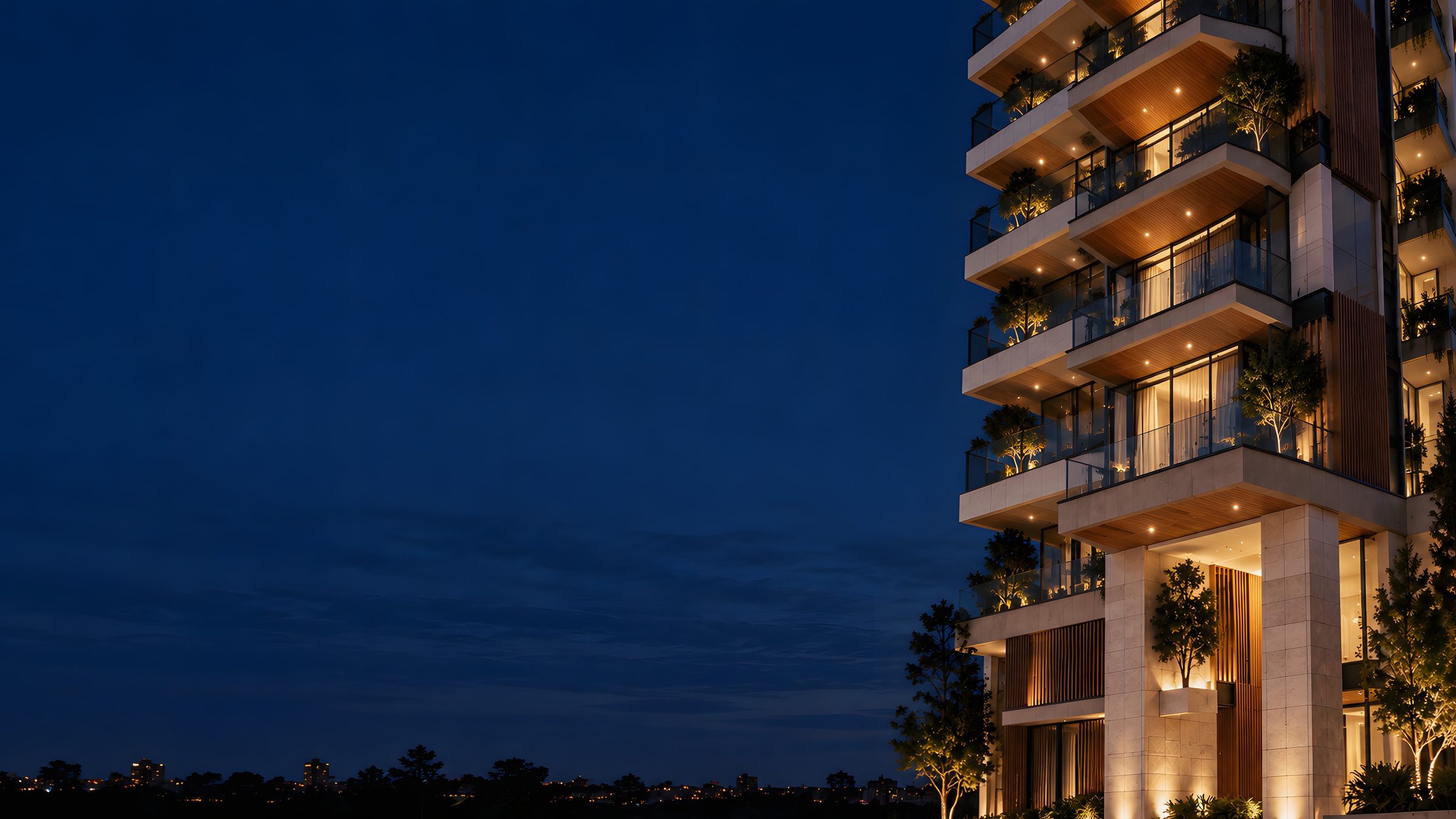 Edifício residencial iluminado à noite (imagem ilustrativa)